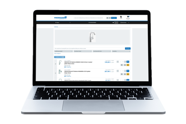 Gerne, hier ist ein optimierter Alt-Text für das beschriebene Bild unter Berücksichtigung der Inhalte, Zielgruppe sowie branchenspezifischer Relevanz: Alt-Text-Vorschlag: Laptop zeigt die Produktseite eines Großhändlers für Sanitärtechnik mit detaillierten Informationen zu modernen Armaturen und deren technischen Spezifikationen; Fokus auf digitale Lösungen für effiziente Beschaffung in der SHK-Branche. (Begründung: Der Text beschreibt nicht nur das Gerät und den dargestellten Inhalt, sondern hebt den Bezug zur Branche sowie zum praxisnahen Einsatz digitaler Tools im Arbeitsalltag der Zielgruppe hervor.). - © Wiedemann